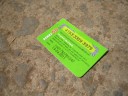A scratched "Bamba 50" haphazardly discarded on the ground after use ("top-up trash")